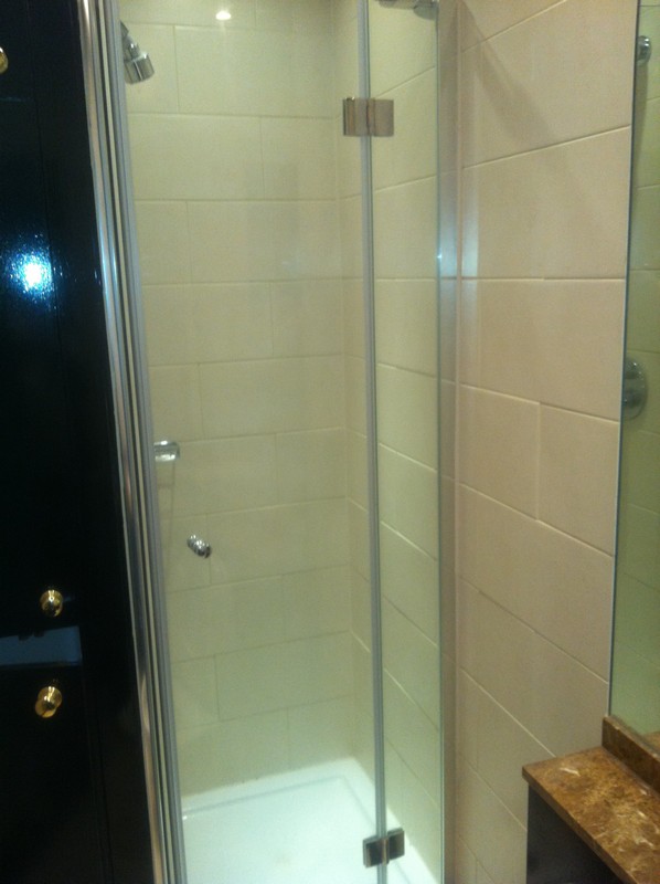 Frameless glass shower enclosure with chrome fittings in Oxford