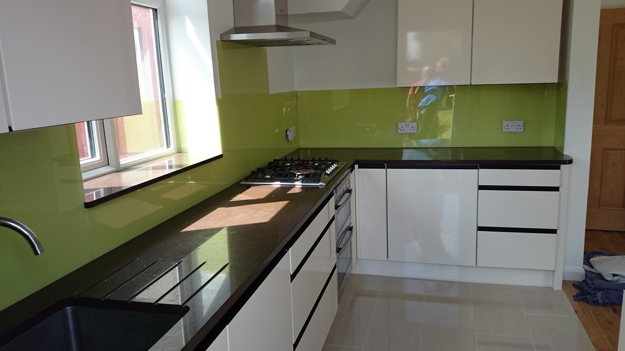 Lime green glass kitchen splashback installed by Oxford glaziers