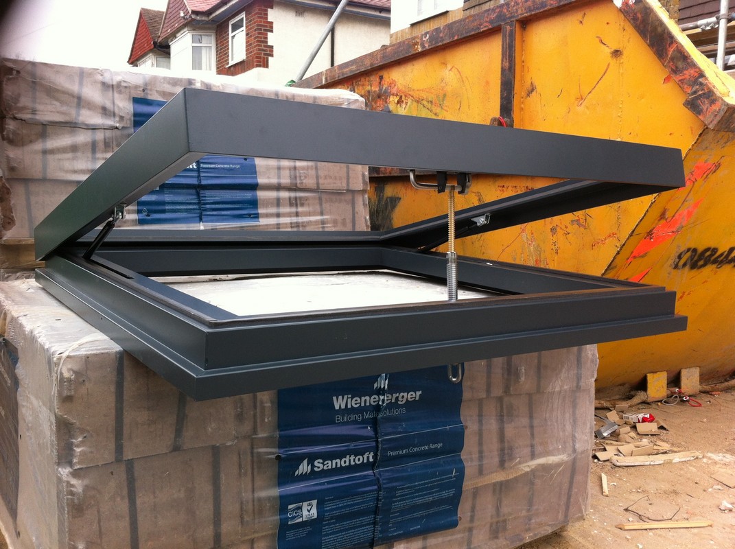 Opening flat roof skylight in anthracite grey installed in Oxford