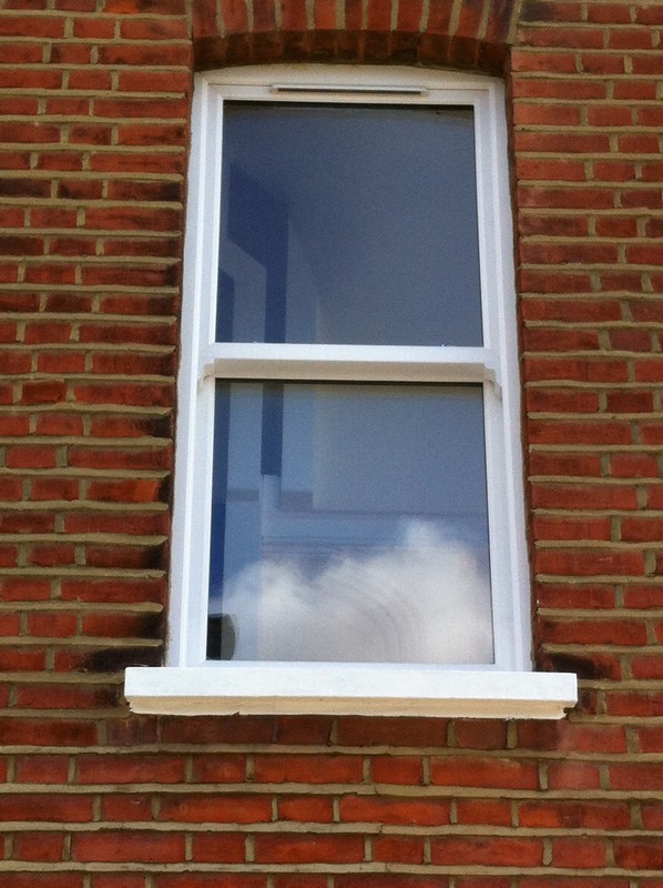 uPVC sash window on Victorian red brick house in Oxford